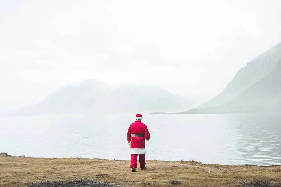 man in santa claus costume to showcase christmas tours in iceland