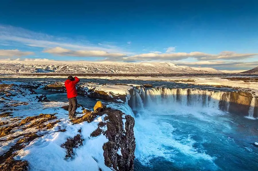 Photographer at Waterfall in Iceland