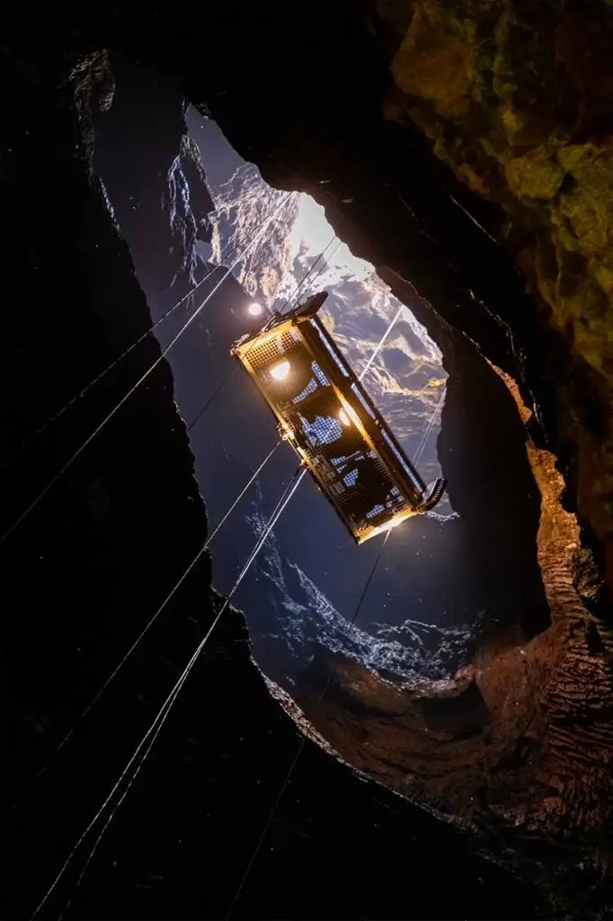 Elevator descending into the cavernous magma chamber of Thrihnukagigur Volcano in Iceland, a unique tourist attraction for adventurous travelers.